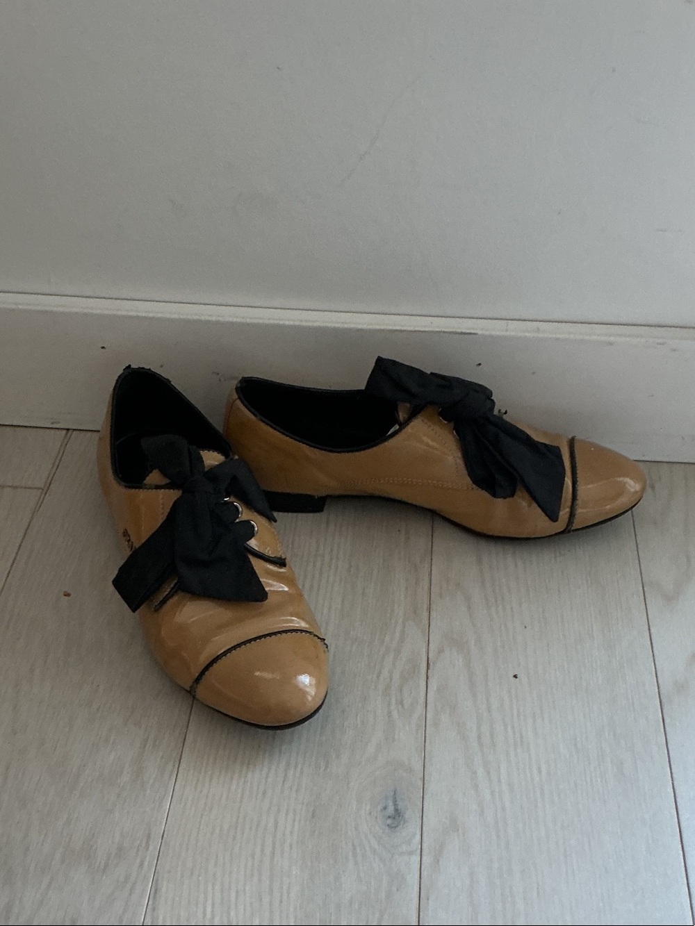 Prada Tan Patent Leather Flats with Black Bow Trim